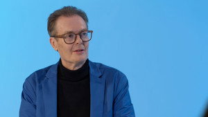Still from In Conversation: Andrew Cartmel