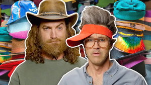 Still from We Try On 37 Different Hats and Slowly Go Mad